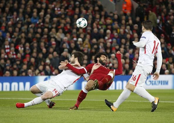 Mohamed Salah of Liverpool is pulled down by Georgi Dzhikiya of Spartak Moscow to earn a penalty during the Champions League Group E match at the Anfield Stadium, Liverpool. Picture date: December 6th 2017. Picture credit should read: Andrew Yates Sportimage EDITORIAL USE ONLY. No use with unauthorised audio, video, data, fixture lists, club league logos or live services. Online in-match use limited to 120 images, no video emulation. No use in betting, games or single club league player publications.