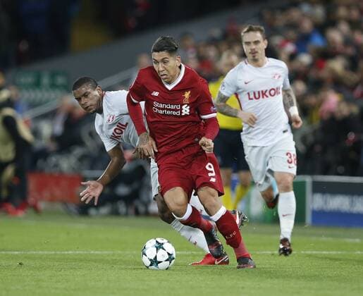 Roberto Firmino of Liverpool in action with Fernando of Spartak Moscow during the Champions League Group E match at the Anfield Stadium, Liverpool. Picture date: December 6th 2017. Picture credit should read: Andrew Yates Sportimage EDITORIAL USE ONLY. No use with unauthorised audio, video, data, fixture lists, club league logos or live services. Online in-match use limited to 120 images, no video emulation. No use in betting, games or single club league player publications.