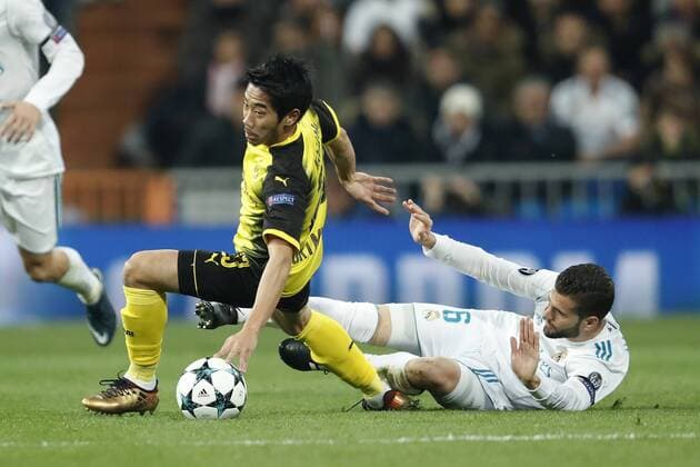 (L-R) Shinji Kagawa of Borussia Dortmund, Nacho of Real Madrid during the UEFA Champions League group H match between Real Madrid and Borussia Dortmund on December 06, 2017 at the Santiago Bernabeu stadium in Madrid, Spain. UEFA Champions League 2017 2018 xVIxVIxImagesx xMauricexvanxSteenxIVx 9502076