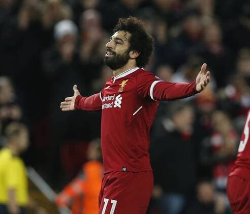 Mohamed Salah of Liverpool celebrates scoring the seventh goal during the Champions League Group E match at the Anfield Stadium, Liverpool. Picture date: December 6th 2017. Picture credit should read: Andrew Yates Sportimage EDITORIAL USE ONLY. No use with unauthorised audio, video, data, fixture lists, club league logos or live services. Online in-match use limited to 120 images, no video emulation. No use in betting, games or single club league player publications.