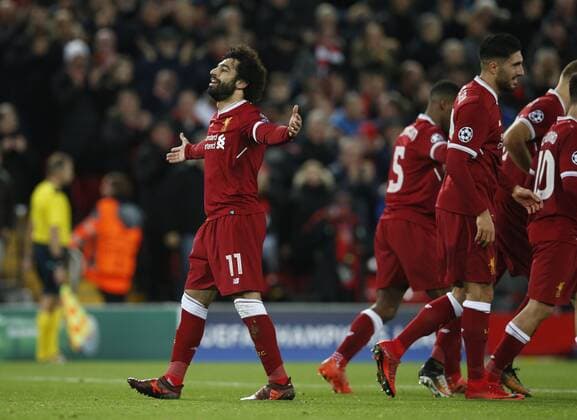 Mohamed Salah of Liverpool celebrates scoring the seventh goal during the Champions League Group E match at the Anfield Stadium, Liverpool. Picture date: December 6th 2017. Picture credit should read: Andrew Yates Sportimage EDITORIAL USE ONLY. No use with unauthorised audio, video, data, fixture lists, club league logos or live services. Online in-match use limited to 120 images, no video emulation. No use in betting, games or single club league player publications.