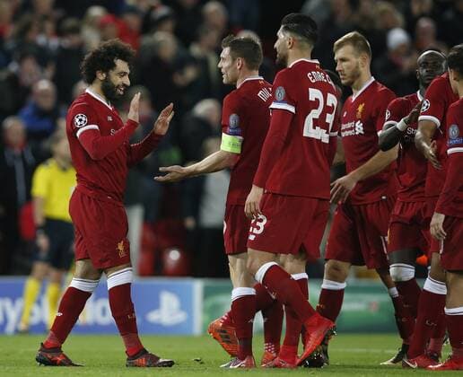 Mohamed Salah of Liverpool celebrates scoring his goal during the Champions League Group E match at the Anfield Stadium, Liverpool. Picture date: December 6th 2017. Picture credit should read: Andrew Yates Sportimage EDITORIAL USE ONLY. No use with unauthorised audio, video, data, fixture lists, club league logos or live services. Online in-match use limited to 120 images, no video emulation. No use in betting, games or single club league player publications.
