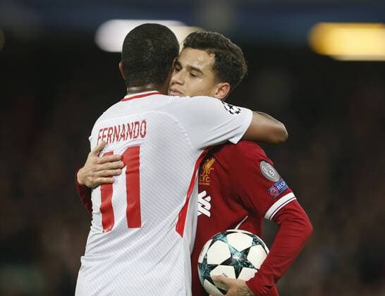 Fernando of Spartak Moscow hugs hat trick striker Philippe Coutinho of Liverpool during the Champions League Group E match at the Anfield Stadium, Liverpool. Picture date: December 6th 2017. Picture credit should read: Andrew Yates Sportimage EDITORIAL USE ONLY. No use with unauthorised audio, video, data, fixture lists, club league logos or live services. Online in-match use limited to 120 images, no video emulation. No use in betting, games or single club league player publications.