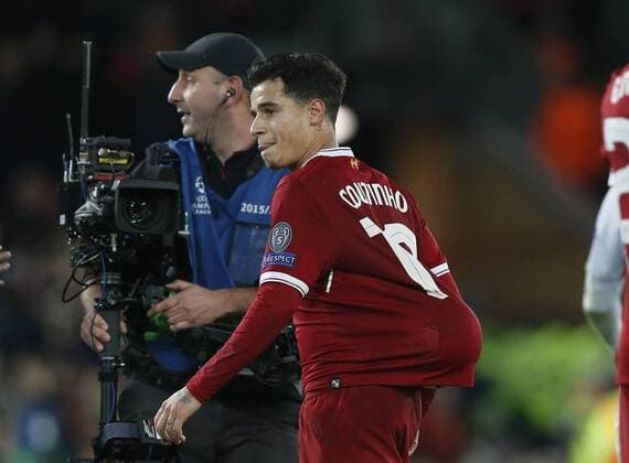 Philippe Coutinho of Liverpool hat rick scorer puts the match ball under his shirt during the Champions League Group E match at the Anfield Stadium, Liverpool. Picture date: December 6th 2017. Picture credit should read: Andrew Yates Sportimage EDITORIAL USE ONLY. No use with unauthorised audio, video, data, fixture lists, club league logos or live services. Online in-match use limited to 120 images, no video emulation. No use in betting, games or single club league player publications.