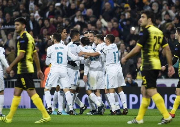 Real Madrid s players celebrate goal and Borussia Dortmund s during Champions League Group H match 6. December 6,2017.  (8308)