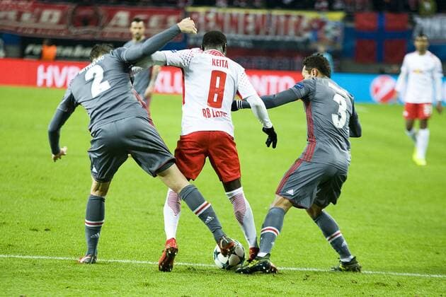 Football Champions League 2017 2018 Group Stage 6 Gameday RB Leipzig Besiktas Istanbul 06 12 2017 Battle for the ball between Naby Keita RBL Center Adriano Istanbul re and Matej Mitrovic Istanbul li Leipzig Saxony Germany