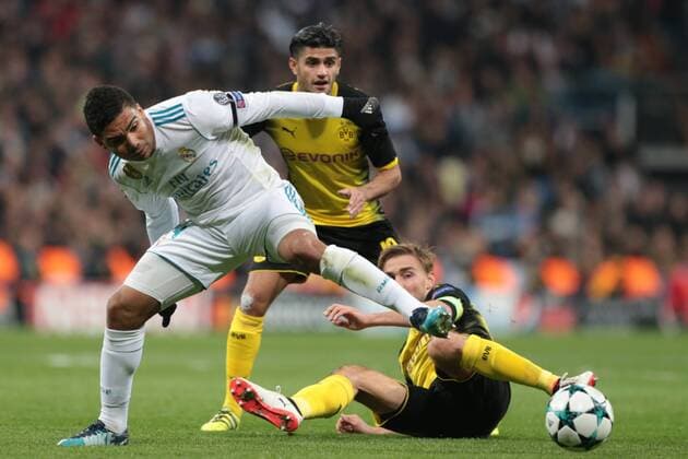(171207) -- MADRID, Dec. 7, 2017 -- Casemiro(L) of Real Madrid competes during the UEFA Champions League group H football match between Real Madrid CF and Borussia Dortmund at the Santiago Bernabeu stadium in Madrid on December 6, 2017. Real Madrid won 3-2. ) (SP)SPAIN-MADRID-UEFA-CHAMPIONS LEAGUE-REAL MADRID-DORTMUND JuanxCarlosxRojas 
