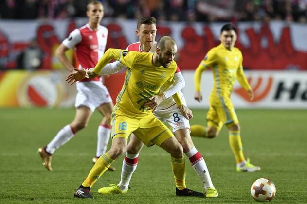 Ivan Majevski of Astana, front, and Jaromir Zmrhal of Slavia in action during the 6th round, group A, European League soccer match SK Slavia Praha vs FC Astana in Prague, Czech Republic, December 7, 2017. (CTKxPhoto MichalxKamaryt) CTKPhotoP201712071022301  _KMT9118