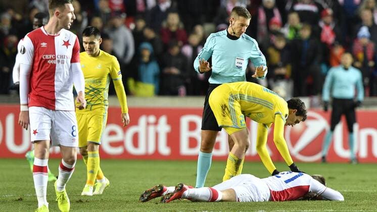 Milan Skoda of Slavia, laying after collision with Ivan Majevski (not on the photo) during the 6th round, group A, European League soccer match SK Slavia Praha vs FC Astana in Prague, Czech Republic, December 7, 2017. (CTKxPhoto MichalxKamaryt) CTKPhotoP201712071034101  _KMT9141
