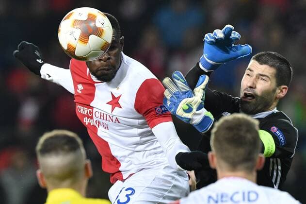 Michael Ngadeu Ngadjui of Slavia, left, and goalkeeper Nenad Eric of Astana in action during the 6th round, group A, European League soccer match SK Slavia Praha vs FC Astana in Prague, Czech Republic, December 7, 2017. (CTKxPhoto MichalxKamaryt) CTKPhotoP201712071038601  _KMT9204