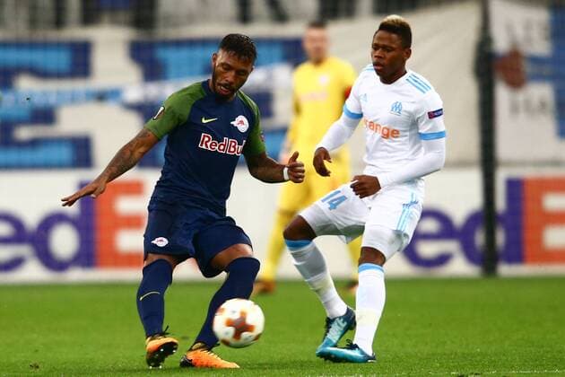 SOCCER - EL, Marseille vs RBS MARSEILLE,FRANCE,07.DEC.17 - SOCCER - UEFA Europa League, Olympique de Marseille vs Red Bull Salzburg. Image shows Paulo Miranda (RBS) and Clinton Njie (Marseille). GEPAxpictures xFelixxRoittner