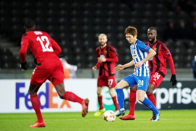 171207 Hertha Berlins Genki Haraguchi and Östersund Ronald Mukiibi during the football match in the European League between Hertha Berlin and Östersund on December 7, 2017 in Berlin  Copyright: PETTERxARVIDSON BB171207PA049