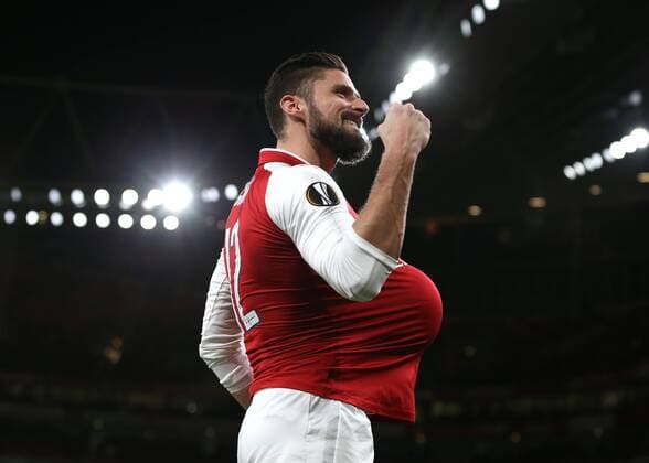 7th December 2017, Emirates Stadium, London, England; UEFA Europa League football, Arsenal versus BATE Borisov; Olivier Giroud of Arsenal celebrates by tucking the ball under his shirt after scoring his sides 5th goal from a penalty during the 2nd half to make it 5-0  ActionPlus11959816
