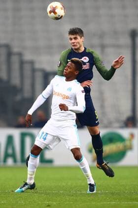 SOCCER - EL, Marseille vs RBS MARSEILLE,FRANCE,07.DEC.17 - SOCCER - UEFA Europa League, Olympique de Marseille vs Red Bull Salzburg. Image shows Clinton Njie (Marseille) and Duje Caleta-Car (RBS). GEPAxpictures xFelixxRoittner