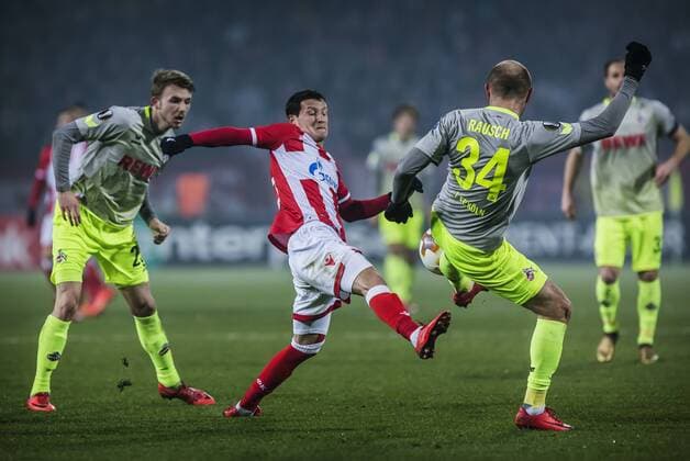 FuÃŸball, EL, Roter Stern Belgrad - 1. FC KÃ¶ln 7th December 2017, Rajko Mitic Stadium, Belgrade, Serbia, UEFA Europa League football, Red Star Belgrade versus FC Cologne; Midfielder Slavoljub Srnic of Red Star Belgrade in action against Defender Konstantin Rausch of FC Kaln  ActionPlus11959829