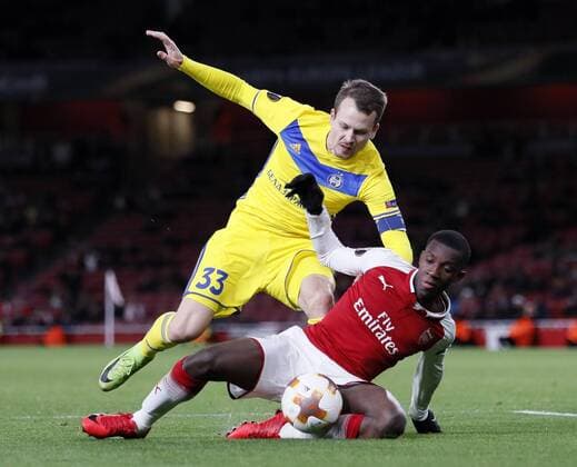 Arsenal s Eddie Nketiah tussles with Bate Borisov s Denis Polyakov during the Europa League Group H match at The Emirates Stadium, London. Picture date: December 7th 2017. Picture credit should read: David Klein Sportimage EDITORIAL USE ONLY. No use with unauthorised audio, video, data, fixture lists, club league logos or live services. Online in-match use limited to 120 images, no video emulation. No use in betting, games or single club league player publications.