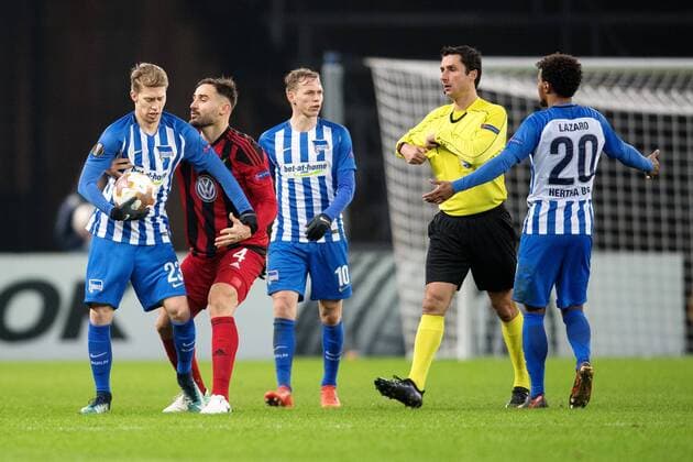171207 Hertha Berlins Mitchell Weiser halls the ball while Östersunds Sotirios Papagiannopoulus tries to take it during the football match in the European League between Hertha Berlin and Östersund on December 7, 2017 in Berlin  Copyright: PETTERxARVIDSON BB171207PA140