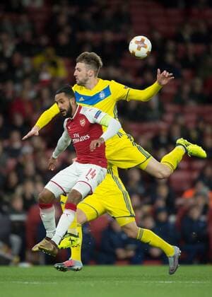 Theo Walcott of Arsenal and Nemanja MilunoviÄ‡ of FC BATE Borisov during the UEFA Europa League match between Arsenal and BATE at the Emirates Stadium, London, England on 7 December 2017. Copyright: xVincexMignottx 18120042