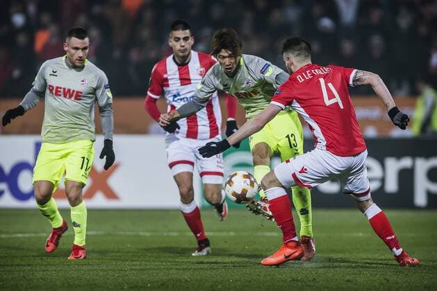 7th December 2017, Rajko Mitic Stadium, Belgrade, Serbia, UEFA Europa League football, Red Star Belgrade versus FC Cologne; Midfielder Damien Le Tallec of Red Star Belgrade tries to block the shot from Forward Yuya Osako of FC Kaln  ActionPlus11959844