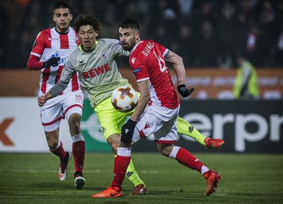 7th December 2017, Rajko Mitic Stadium, Belgrade, Serbia, UEFA Europa League football, Red Star Belgrade versus FC Cologne; Forward Yuya Osako of FC Kaln shoots on the goal past Damien Le Tallec of Red Star Belgrade  ActionPlus11959845