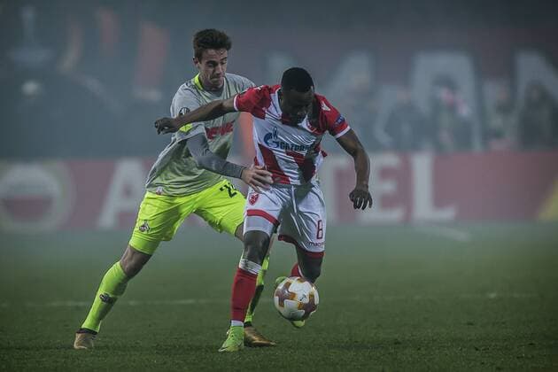 7th December 2017, Rajko Mitic Stadium, Belgrade, Serbia, UEFA Europa League football, Red Star Belgrade versus FC Cologne; Midfielder Guelor Kanga of Red Star Belgrade against Defender Lukas Klunter of FC Kaln  ActionPlus11959851