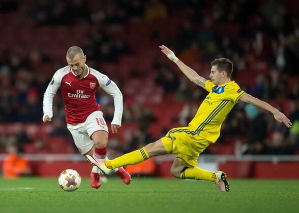 Jack Wilshere of Arsenal is tackled by Aleksei Rios of FC BATE Borisov during the UEFA Europa League match between Arsenal and BATE at the Emirates Stadium, London, England on 7 December 2017. Copyright: xVincexMignottx 18120046