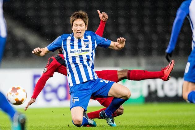 171207 Hertha Berlins Genki Haraguchi falls in battle with Östersund Fouad Bachirou during the football match in the European League between Hertha Berlin and Östersund on December 7, 2017 in Berlin  Copyright: PETTERxARVIDSON BB171207PA170