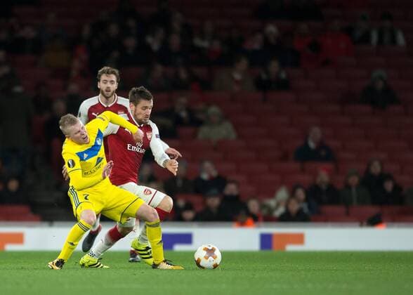 Mathieu Debuchy of Arsenal battles with Evgeni Berezkin of FC BATE Borisov during the UEFA Europa League match between Arsenal and BATE at the Emirates Stadium, London, England on 7 December 2017. Copyright: xVincexMignottx 18120058