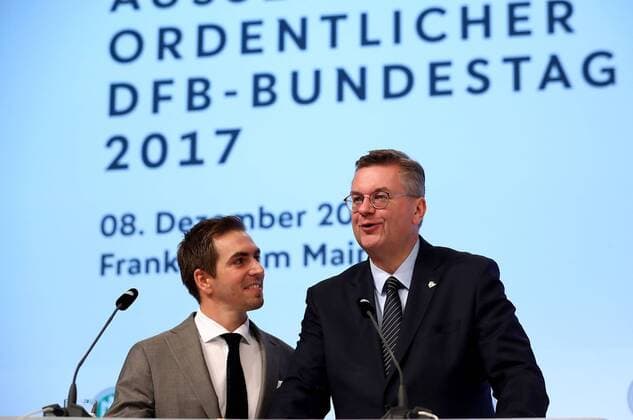 08 12 2017 xfux Football DFB Extraordinary DFB Bundestag 2017 emspor vl Newly awared honorary team captain of the German national team and UEFA UEFA Euro 2024 campaign Ambassador Philipp Lahm L looks on while DFB President Reinhard Grindel talks to the audience during the Extraordinary DFB Bundestag at Messe Frankfurt on December 8 2017 in Frankfurt Germany Frankfurt am Main