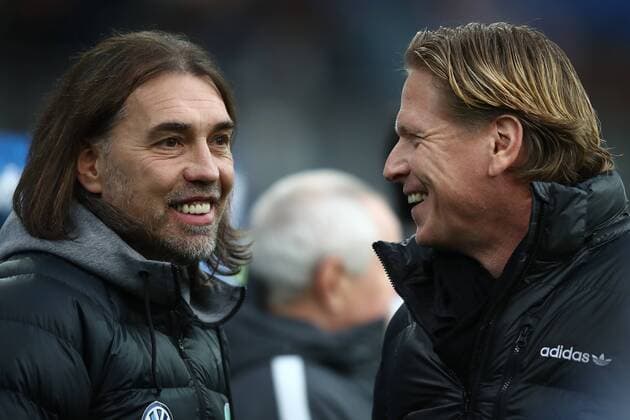 HAMBURG GERMANY December 09 Head Coach Markus Gisdol R of Hamburg and Head Coach Martin Schmidt L of Wolfsburg will be playing in the Bundesliga match between Hamburger Sport Club and VfL Wolfsburg at the Volksparkstadion on December 09 2017 in Hamburg