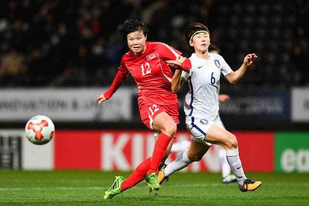 CHIBA, JAPAN - DECEMBER 11: Kim Yun Mi 12 of North Korea and Lim Seonjoo 6 of South Korea compete for the ball during the EAFF E-1 Women s Football Championship between North Korea and South Korea at Fukuda Denshi Arena on December 11, 2017 in Chiba, Japan.  Copyright: xVCGx CFP111140546558 