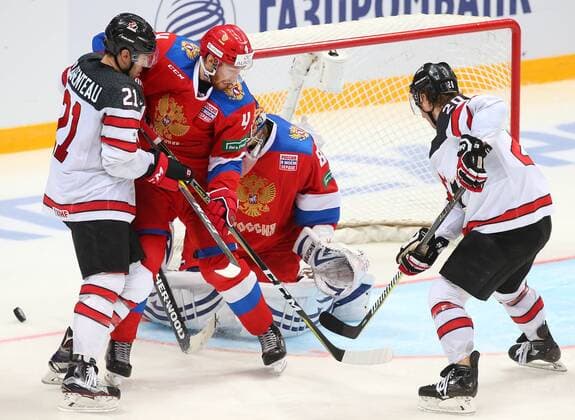 MOSCOW, RUSSIA â€“ DECEMBER 16, 2017: Russiaâ€™s goaltender Vasily Koshechkin (C back) supported by Vladislav Gavrikov (C front) defends against Canadaâ€™s Pierre-Alexandre Parenteau (L) and Matt Ellison in their 2017-18 Euro Hockey Tour Channel One Cup Ice hockey Eishockey match at the VTB Ice Palace. Anton Novoderezhkin TASS  TS06D695