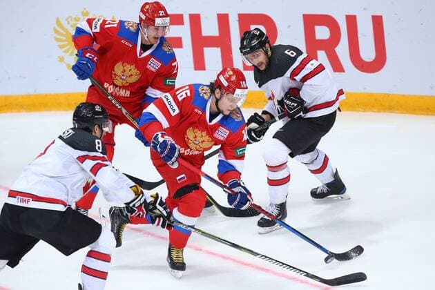 MOSCOW, RUSSIA â€“ DECEMBER 16, 2017: Russiaâ€™s Sergei Plotnikov (C front), Sergei Kalinin (C back), Canadaâ€™s Wojtek Wolski (L front) and Maxim Noreau in their 2017-18 Euro Hockey Tour Channel One Cup Ice hockey Eishockey match at the VTB Ice Palace. Anton Novoderezhkin TASS  TS06D69D