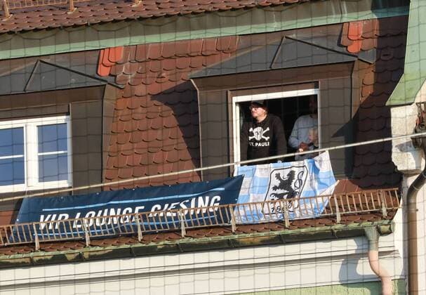 VIP Lounge Giesing 1860 fans watch the game on the opposite side of the street from her apartment from football Grünwald er Stadium 31 10 2017 TSV 1860 München SpVgg Bayreuth Bavaria