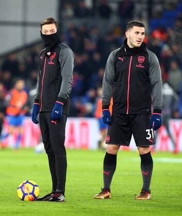 December 28, 2017 - London, England, United Kingdom - L-R Arsenal s Mesut Ozil and Arsenal s Sead Kolasinac during the pre-match warm-up ..during Premier League match between Crystal Palace and Arsenal at Selhurst Park Stadium, London, England 28 Dec 2017. Crystal Palace v Arsenal - Premier League  - ZUMAn230 20171228_zaa_n230_181 Copyright: xKieranxGalvinx
