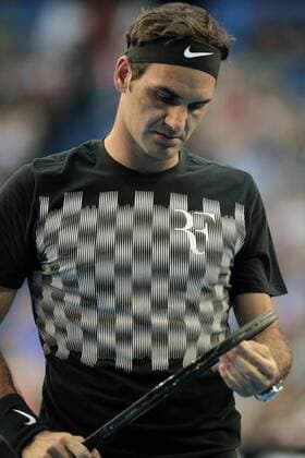 29th December 2017, Perth Arena, Perth, Australia; MasterCard Hopman Cup Tennis; Roger Federer of Team Switzerland checks his raquet strings during his training session with Thanasi Kokkinakis of Team Australia  ActionPlus11966009