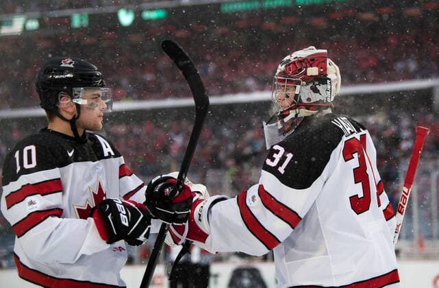 171229 Canada s Kale Clague and malvakt Carter Hart exults after Canada made 2 0 during ice hockey match between Canada and the United States in the JVM on 29 december 2017 in Buffalo  Copyright: JOELxMARKLUND BB171229JM048