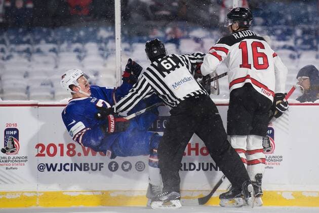 171229 United States s Brady Tkachuk is pressed by a line judge who goes between him and Canadian ice hockey match of Taylor during Raddysh JVM between Canada and the United States 29 december 2017 in Buffalo  Copyright: JOELxMARKLUND BB171229JM102