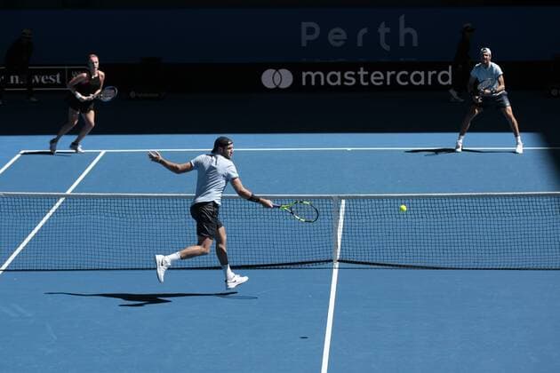 30th December 2017, Perth Arena, Perth, Australia; MasterCard Hopman Cup Tennis; Jack Sock of Team USA chases a return of serve from Anastasia Pavlyuchenkova of Team Russia during the mixed doubles won by Russia 2-1  ActionPlus11966270