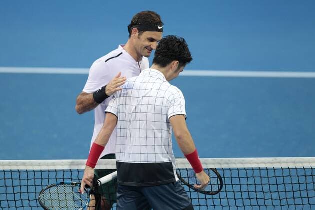 30th December 2017, Perth Arena, Perth, Australia; MasterCard Hopman Cup Tennis; Roger Federer of Team Switzerland greets Yuchi Sugita of Team Japan at the net after winning their match 2 sets to love  ActionPlus11966366