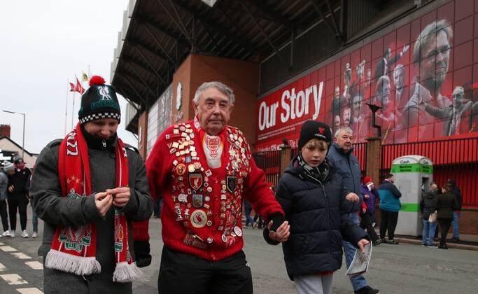 30th December 2017, Anfield, Liverpool, England; EPL Premier League football, Liverpool versus Leicester City; a veteran Liverpool fan wearing his badge collection outside of the entrance to the Kop  ActionPlus11966401