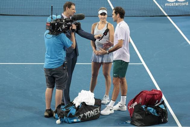 30th December 2017, Perth Arena, Perth, Australia; MasterCard Hopman Cup Tennis; Roger Federer and Belinda Bencic of Team Switzerland are interviewed after winning the mixed doubles against Japan by perth radio and tv personality Basil Zempilas  ActionPlus11966418
