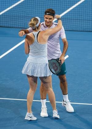 ROGER FEDERER and BELINDA BENCIC mixed emotion embrace after their victory doubles tennis Hopman Cup 2018 ITF Perth arena Perth Western Australia Australia 30 December 2017 Copyright: xJuergenxHasenkopfx