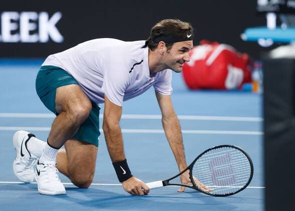 ROGER FEDERER kneels in wait on the network funny team SWITZERLAND tennis Hopman Cup 2018 ITF Perth arena Perth Western Australia Australia 2 January 2018 Â Copyright: xJuergenxHasenkopfx