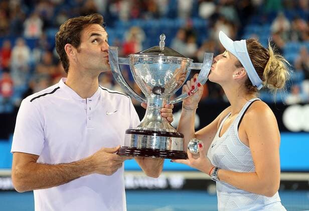 (180107) -- PERTH, Jan. 7, 2018 -- Roger Federer (L) and Belinda Bencic of Switzerland kiss the trophy after winning the final against Alexander Zrevev and Angelique Kerber of Germany at Hopman Cup mixed teams tennis tournament in Perth, Australia, on Jan. 6, 2018. Switzerland claimed the title with 2-1. ) (SP)AUSTRALIA-PERTH-TENNIS-HOPMAN CUP ZhouxDan 
