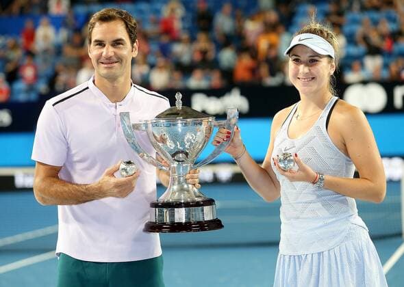(180107) -- PERTH, Jan. 7, 2018 -- Roger Federer (L) and Belinda Bencic of Switzerland pose with the trophy after winning the final against Alexander Zrevev and Angelique Kerber of Germany at Hopman Cup mixed teams tennis tournament in Perth, Australia, on Jan. 6, 2018. Switzerland claimed the title with 2-1. ) (SP)AUSTRALIA-PERTH-TENNIS-HOPMAN CUP ZhouxDan 