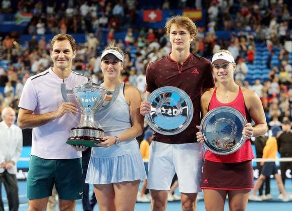 (180107) -- PERTH, Jan. 7, 2018 -- (L-R) Roger Federer, Belinda Bencic of Switzerland, Alexander Zverev and Angelique Kerber of Germany pose during the awarding ceremony for the Hopman Cup mixed teams tennis tournament in Perth, Australia, on Jan. 6, 2018. Switzerland claimed the title with 2-1. ) (SP)AUSTRALIA-PERTH-TENNIS-HOPMAN CUP ZhouxDan 