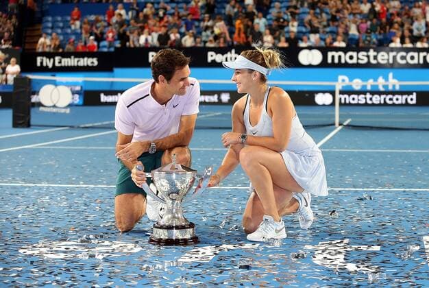 (180107) -- PERTH, Jan. 7, 2018 -- Roger Federer (L) and Belinda Bencic of Switzerland pose with the trophy after winning the final against Alexander Zrevev and Angelique Kerber of Germany at Hopman Cup mixed teams tennis tournament in Perth, Australia, on Jan. 6, 2018. Switzerland claimed the title with 2-1. ) (SP)AUSTRALIA-PERTH-TENNIS-HOPMAN CUP ZhouxDan 