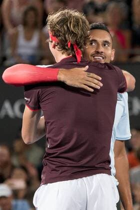 SYDNEY, NSW - JANUARY 8: Alexander Zverev (GER) and Nick Kyrgios (AUS) hug at the FAST4 Tennis Showdown doubles game between Grigor Dimitrov (BUL) and Alexander Zverev (GER) versus Lleyton Hewitt (AUS) and Nick Kyrgios (AUS) on Ken Rosewall Arena at The Sydney Tennis Centre in Sydney on January 08, 2018. (Photo by Steven Markham Icon Sportswire) TENNIS: JAN 08 The FAST4 Tennis Tournament Showdown Icon18010801284 EDITORIAL USE ONLY