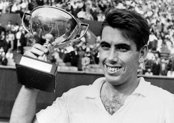 1 JUNE 1964 Manuel Santana holds up the trophy after winning the French Open tennis Championships in Paris, France., Paris France Copyright: Topfoto  UnitedArchivesIPU477938